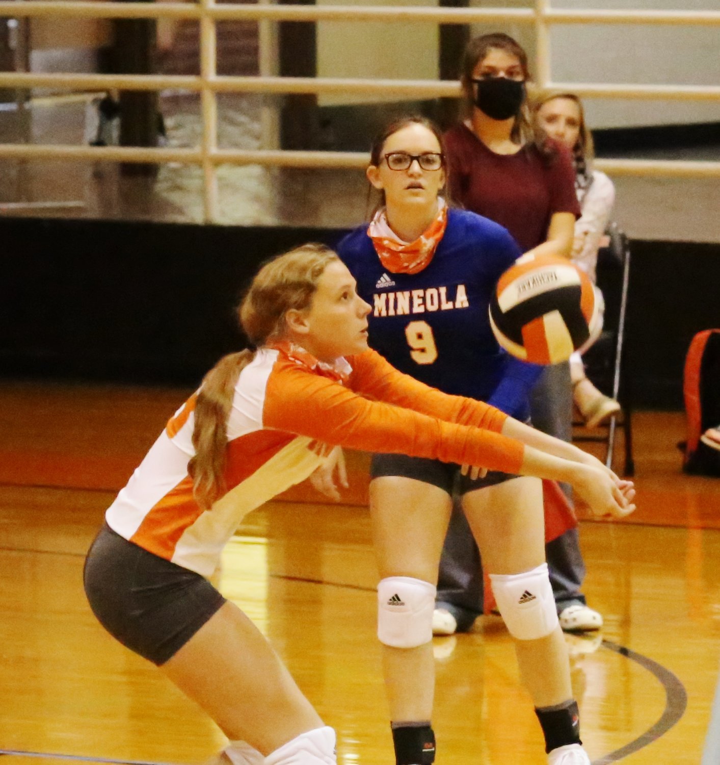 Lady Jacket Mylee Fischer plays the ball from the back line as libero Caidyn Anderson looks on. (Monitor photo by John Arbter)